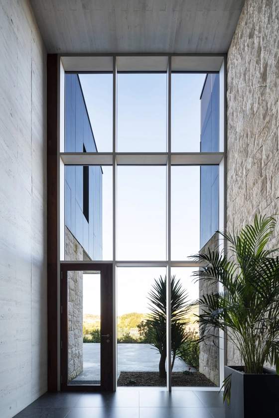 Luxury window installation on a modern Toronto home featuring floor-to-ceiling European aluminum windows