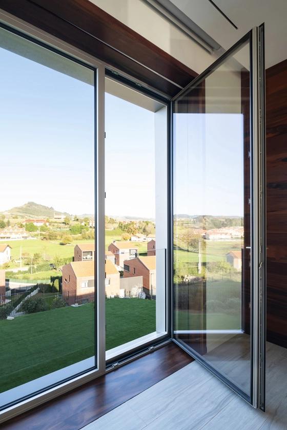 Luxury window installation in a modern Toronto home with floor-to-ceiling glass
