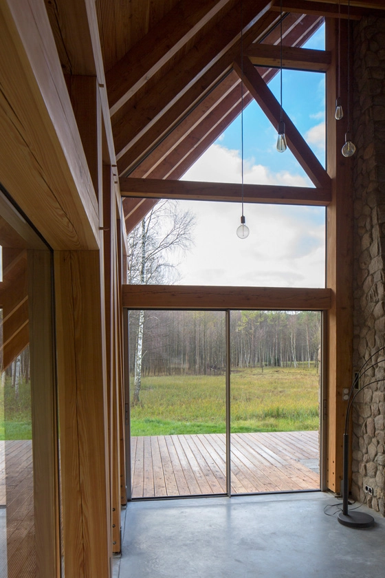 Steel-framed glass walls on A-frame timber residence